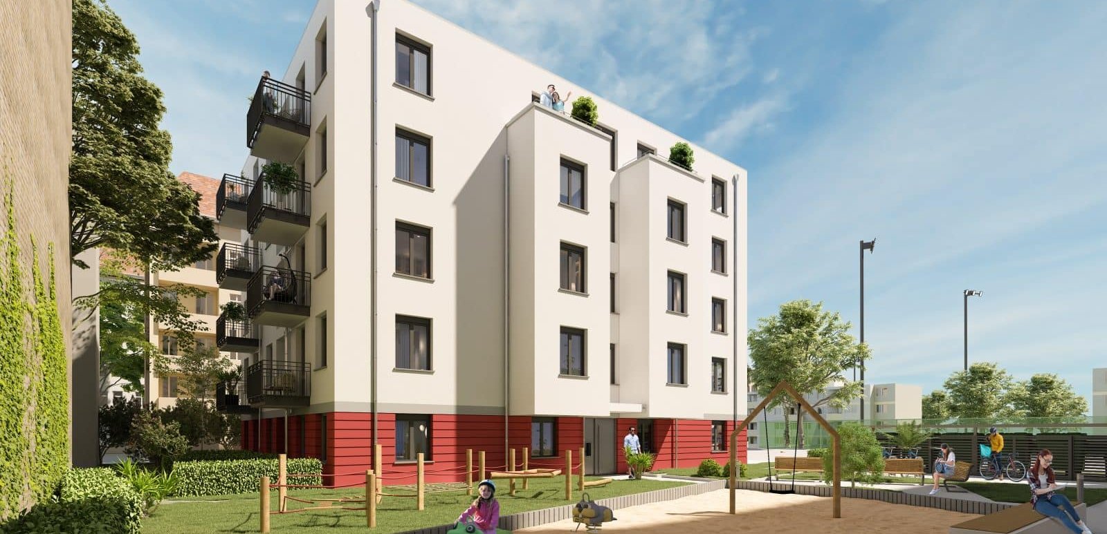 Fassade Mehrfamilienhaus und Spielplatz