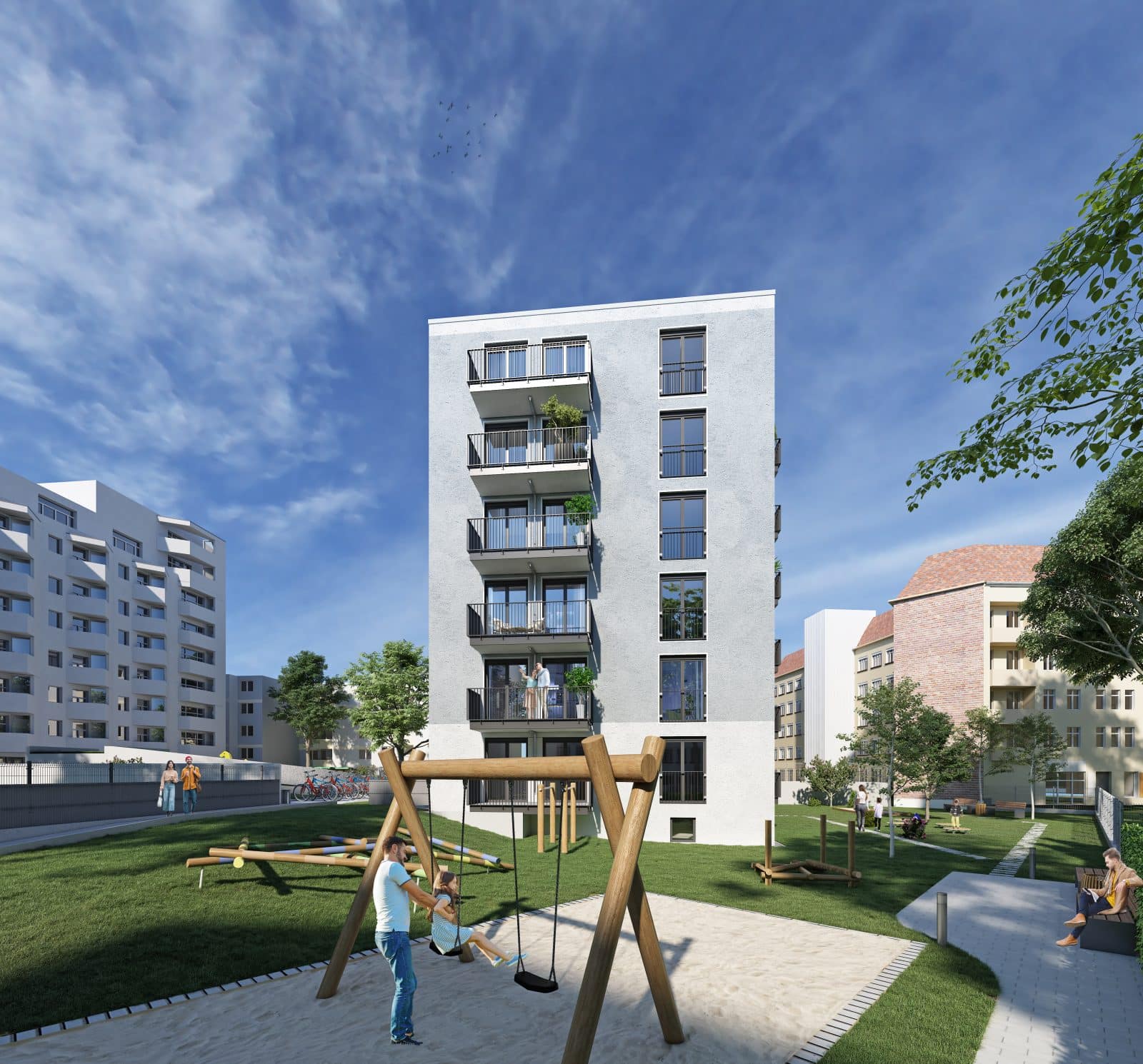 Fassade Mehrfamilienhaus mit Grünflächen und Spielplatz