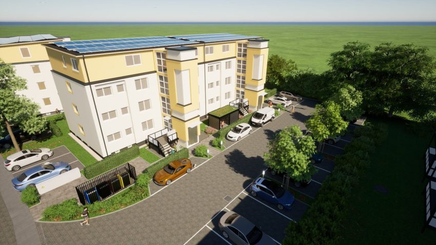 Fassade Mehrfamilienhaus mit Parkplätzen