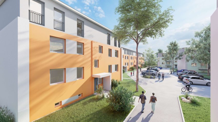 Fassade Mehrfamilienhaus mit Parkplätzen